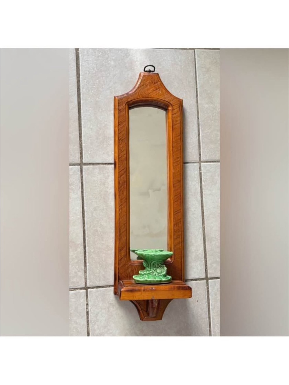 vintage wooden mirror sconce with a green ceramic candle holder
